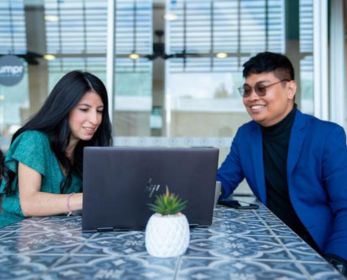 Students looking at a laptop