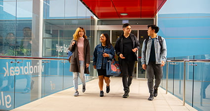 A group of students walking on campus