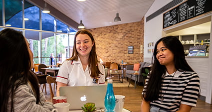 Students seated at a cafe